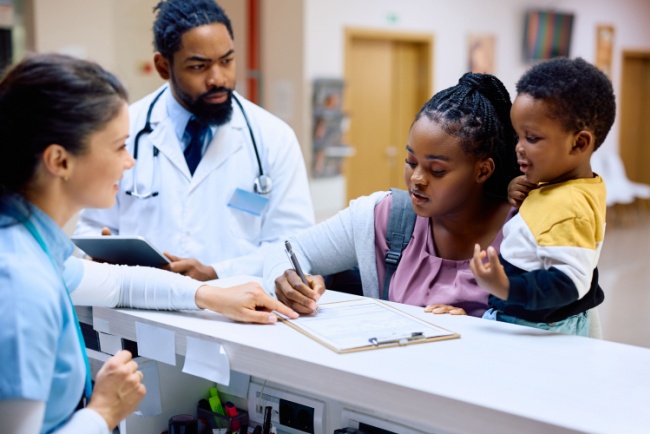 woman with her baby at nurse reception area